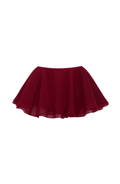 Falda pantalón burdeos con bajo ondulado y falda de tul con volumen