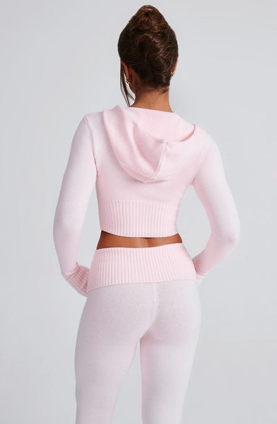 Sudadera rosa con capucha, dobladillo acanalado y cremallera; vista trasera